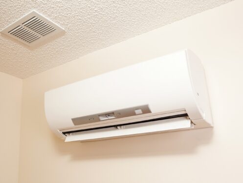 A wall-mount mini-split heating and air conditioning unit installed in a home