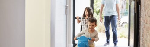 Excited Children Arriving Home With Father